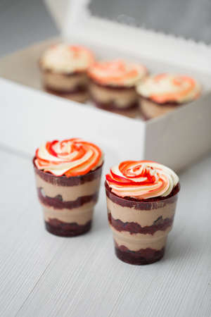 Chocolate and mousse trifle dessert in plastic cups