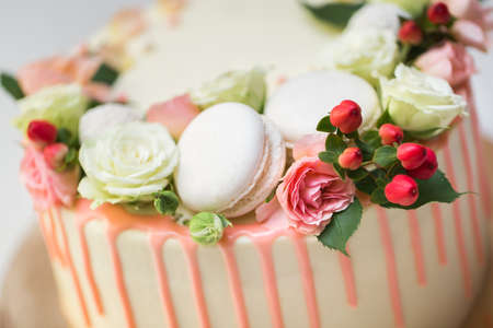 Cake with fresh flowers and almond cookiesの写真素材