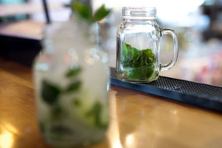 Mojito cocktail in a glass on the bar close-upの写真素材