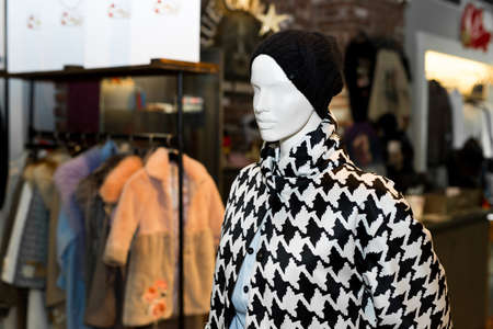 Womens coat on mannequin. Autumn coat. Individual tailoring.