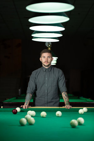 Playing billiard - Close-up shot of a man playing billiard.