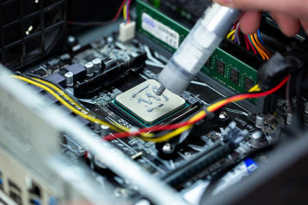 Thermal paste is applied to the laptop processor.