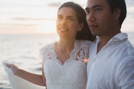 Wedding couple is hugging on a yacht. Beauty bride with groom