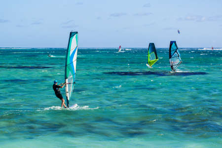 Windsurfers on the Le Morne beach in Mauritius.の写真素材