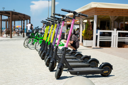 Electric scooter and bicycle for rent. The concept of modern urban transport and technology.の写真素材