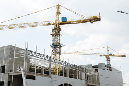 Construction site with crane and building. Construction of a residential multi-storey building.