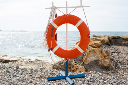 A lifebuoy on the seashore, ocean.