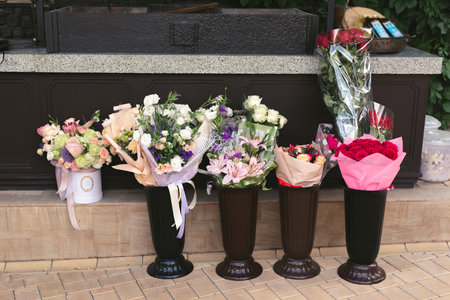 Vases with bouquets of flowers. storage of donated flowers at a banquet in a restaurant.