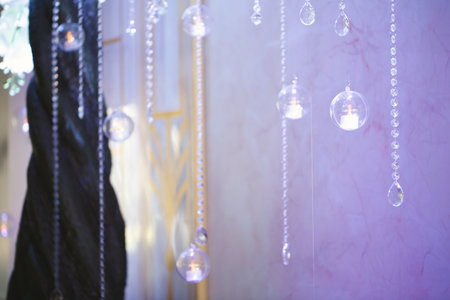 Hanging glass and shiny beads are an element of the wedding decor.の写真素材