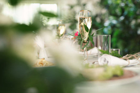 Bride and groom champagne glasses at a wedding reception.