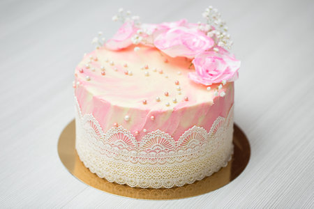 Birthday cake with pink roses.の写真素材