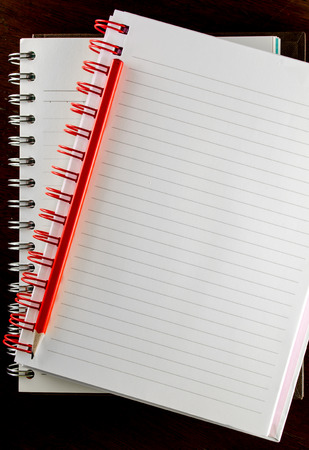 two Notebook  along the wire,  and red pencil on the table の写真素材