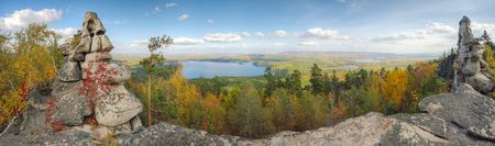 autumn landscape with mountains and lakeの写真素材