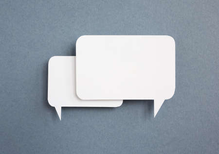 paper speech bubble on grey
 backgroundの写真素材