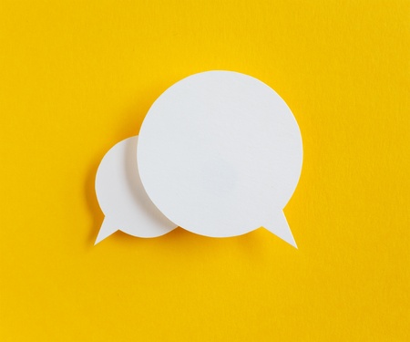 paper speech bubble on yellow background