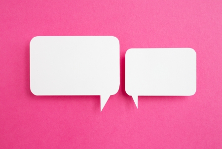 paper speech bubble on pink backgroundの写真素材