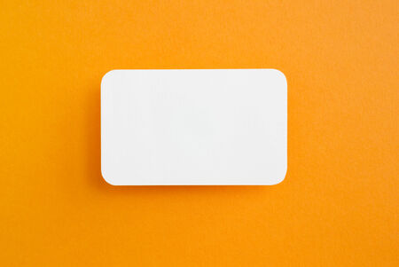 paper speech bubble on yellow backgroundの写真素材