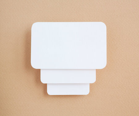 paper speech bubbles on brown background