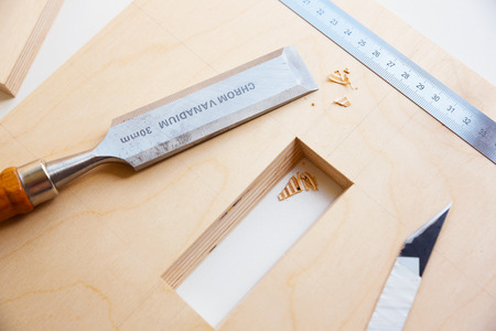 Making a component of wood furniture. Close-up photo