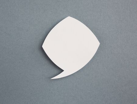 paper speech bubbles on grey background