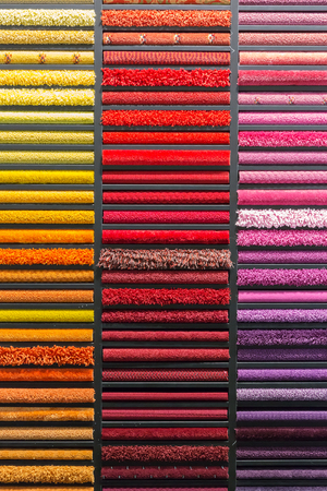 multicolored carpets samples on showcase