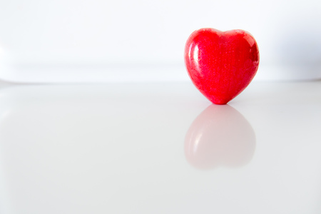 Red heart with reflections on the white backgroundの写真素材