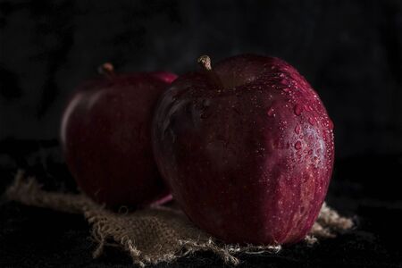 Two red apples on white