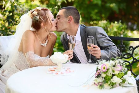 Kissing newly-wed coupleの写真素材