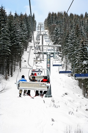 Skiers in chairliftの写真素材