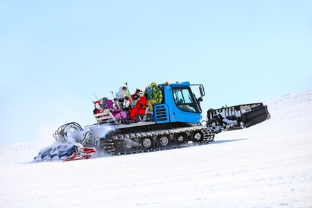 Ratrack taking skiers to top of mountain の写真素材