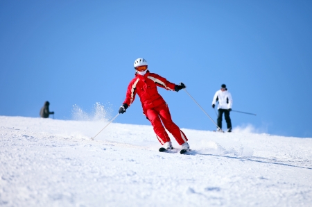 Young female skier on a mountain slope の写真素材