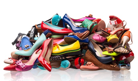 Pile of various female shoes over whiteの写真素材