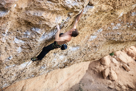 Rock climber on a face of a cliff