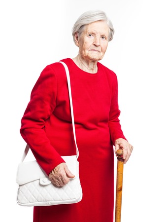 Elegant senior woman standing over white backgroundの写真素材