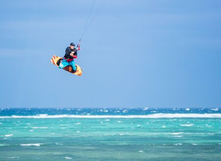 Kiteboarder performing a jumpの写真素材