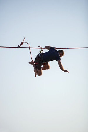 KAROLINO-BUGAZ, UKRAINE - AUGUST 24. Highline walker stumbling while in participating in competition...