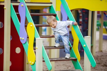 Toddler boy on playgroundの写真素材