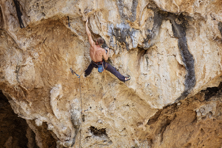 Rock climber on challenging routeの写真素材