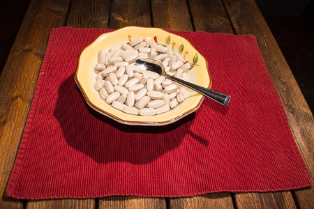 To Many pills for breakfast with spoon.の写真素材