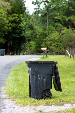 Trash cans set out for garbage collectionの写真素材