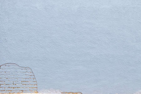 Gray brick and stucco background texture.