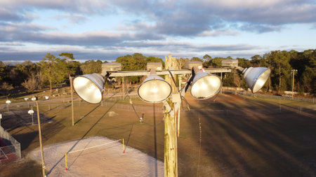 A close up of a set of stadium lights in the park