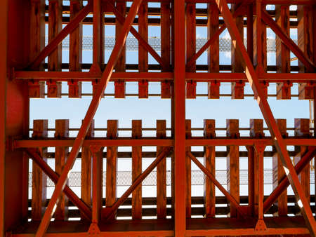 Red railway bridge over the riverの写真素材