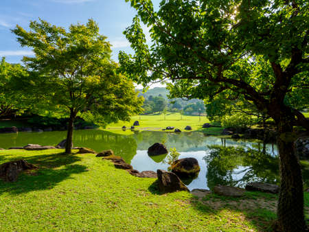 Three shrines of Kasugano-en Garden with blue skyの写真素材
