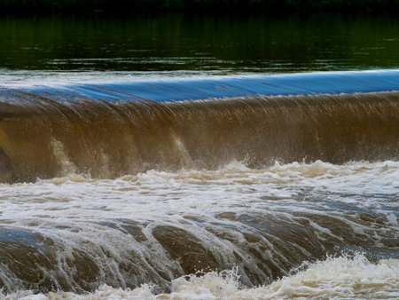 Scenery of a river with increased water after heavy rainsの写真素材