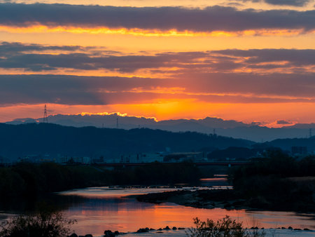 Riverside scenery illuminated by sunriseの写真素材