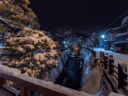 Snow-covered scenery along the Enako River in Hida Takayamaの写真素材