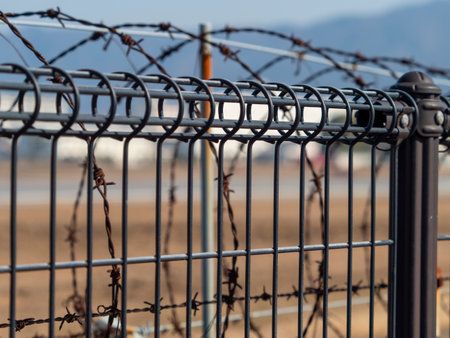 Barbed wire fence installed at the airportの写真素材