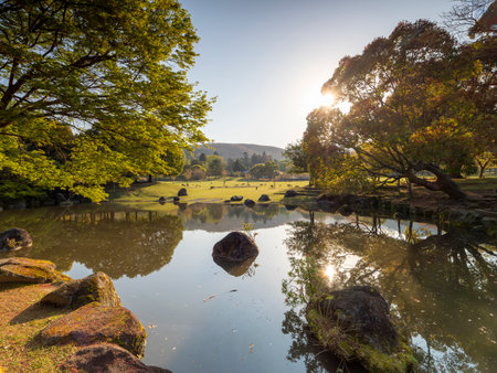 Kasugano Park illuminated by the morning sun and Sansha Shrine Pondの写真素材