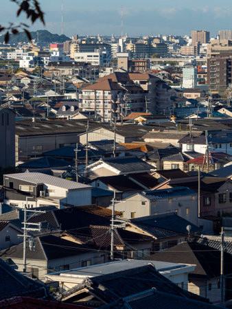 Densely populated residential area seen from high groundの写真素材